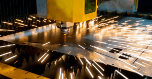 Plasma machine cutting sheet metal.